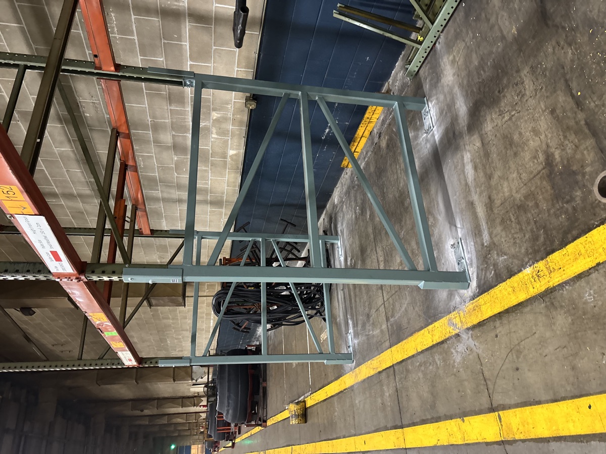A row of installed green Vertical Double Leg rack repairs